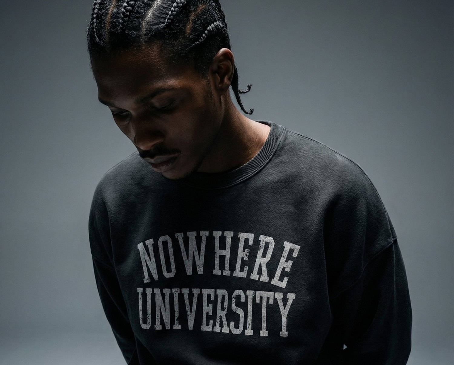 Champion — editorial, Nowhere University crewneck, head down