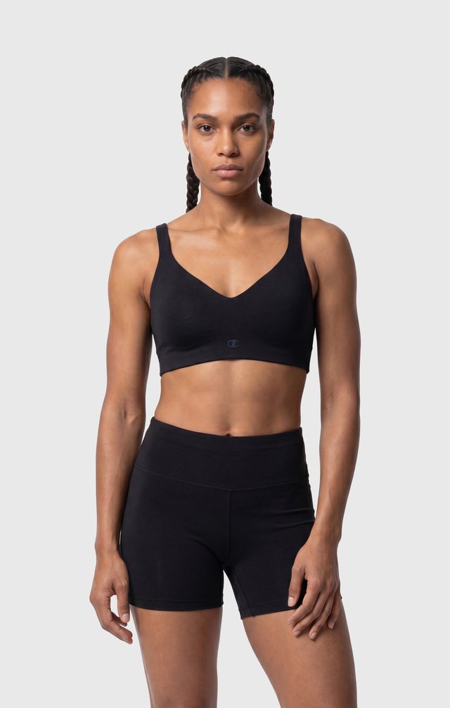 Champion — PDP-01 · Mid, black sports bra and shorts