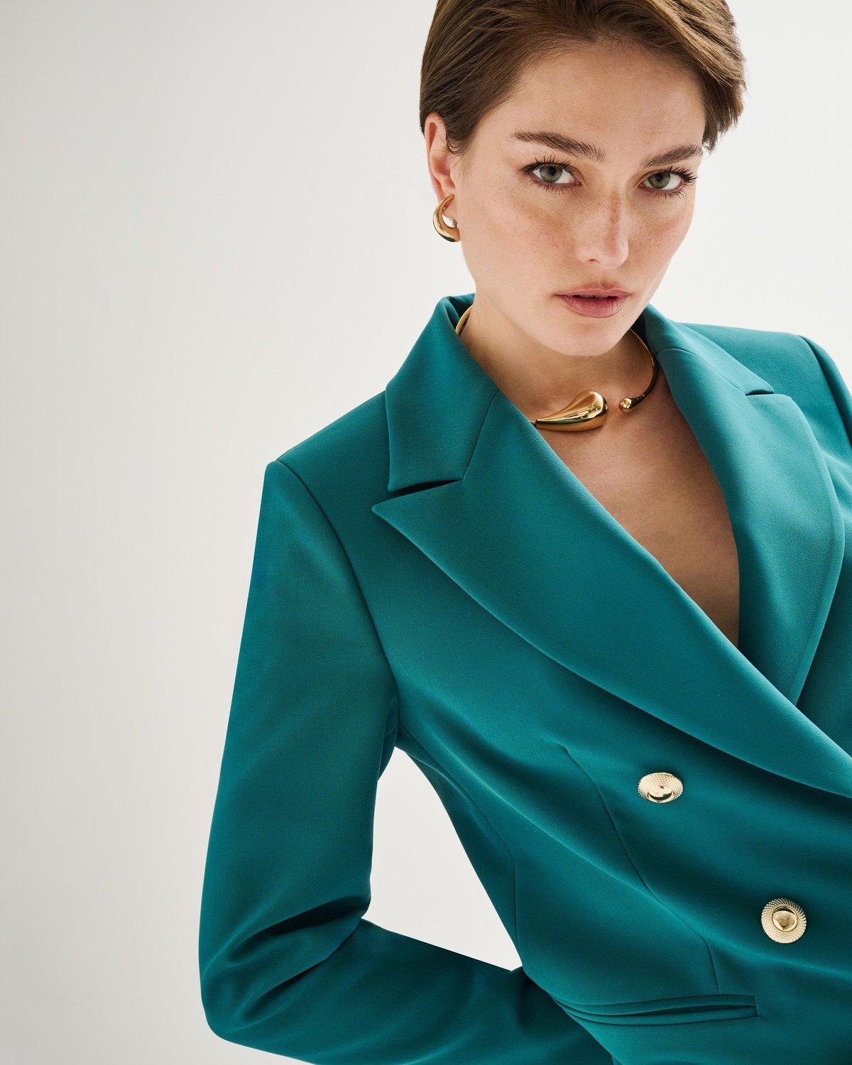 Rinascimento — teal double-breasted jacket, close portrait