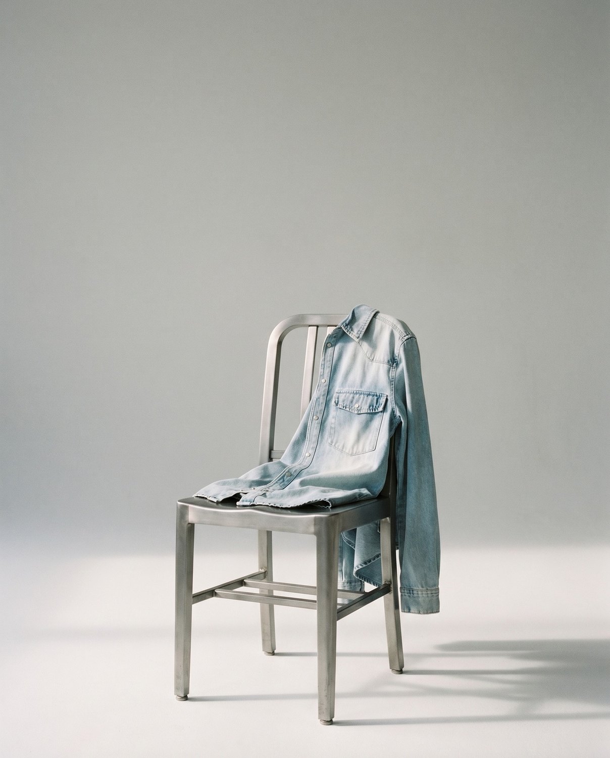 Republica — still life, denim shirt on an aluminium chair