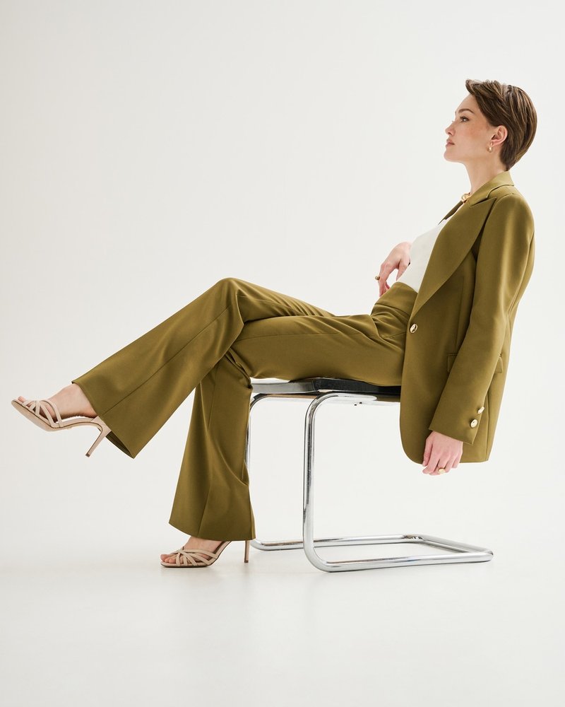 Rinascimento — editorial, olive suit, seated