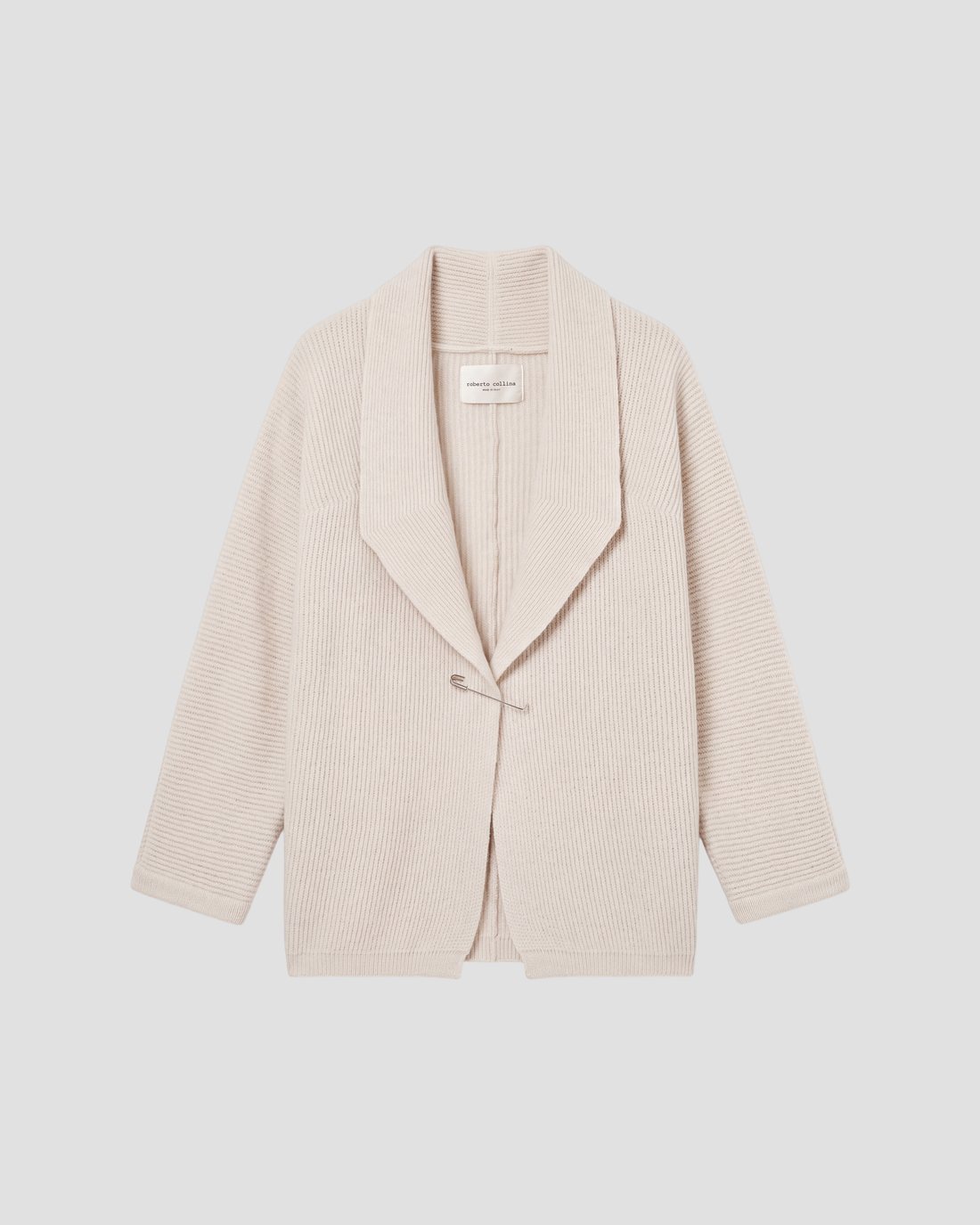Roberto Collina — still life made with AI, cream cardigan